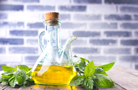 Organic sunflower oil with fresh basilの写真素材