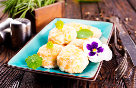 fish cutlets on blue plateの写真素材