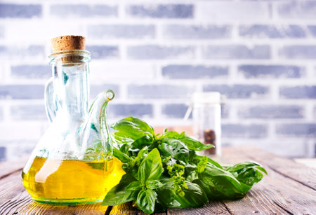 Organic sunflower oil with fresh basilの写真素材