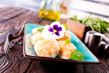 fish cutlets on blue plateの写真素材