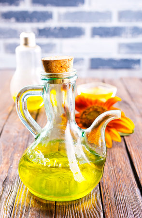 Organic sunflower oil in a small glass jar with sunflower seeds and fresh flowers. Outdoorsの写真素材