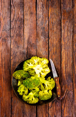 Healthy Green Organic Raw Broccoli on plateの写真素材