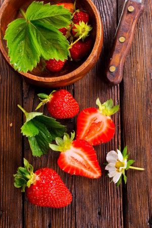 Fresh ripe organic strawberry on wooden tableの写真素材