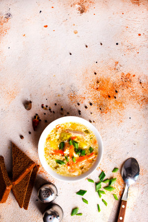 Pea soup with pieces of bacon and parsley in a bowlの写真素材