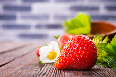 Fresh ripe organic strawberry on wooden tableの写真素材