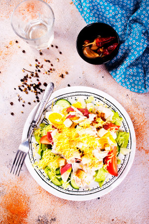Classic caesar salad with grilled chicken fillet and parmesan cheese.の写真素材