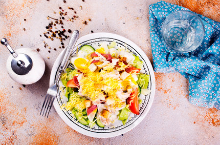 Classic caesar salad with grilled chicken fillet and parmesan cheese.の写真素材