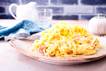 Pasta Carbonara with bacon and parmesan on plate.の写真素材