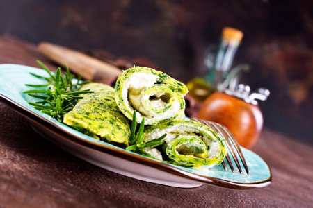 Rolls of spinach pancakes with cheese and fried shrimpsの写真素材