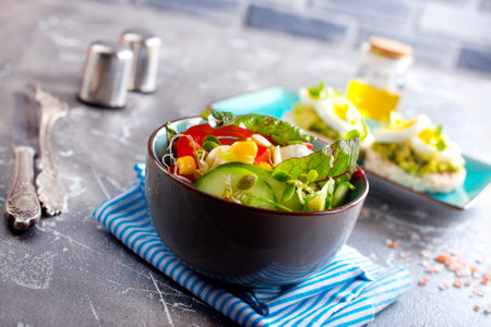 Green vegan salad from green leaves mix and vegetables. Top viewの写真素材