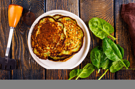 Homemade spinach pancakes on background.の写真素材