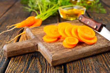 Wooden board with fresh carrots on woodenの写真素材