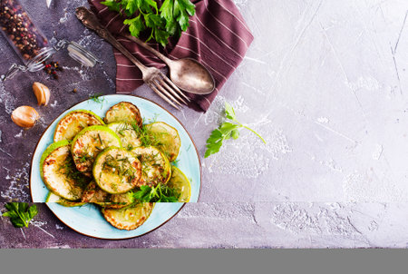 fried zucchini in oil, with salt and garlicの写真素材