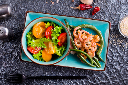 Healthy salad plate. Grilled shrimps and fresh vegetable salad and egg. Grilled prawns.の写真素材