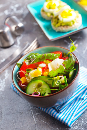 Green vegan salad from green leaves mix and vegetables. Top viewの写真素材