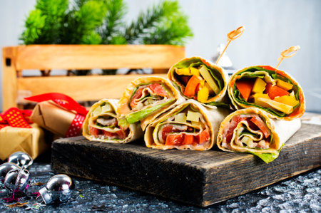 Salmon and cream cheese wraps. Rolls with smoked salmon, basil and rocket salad.