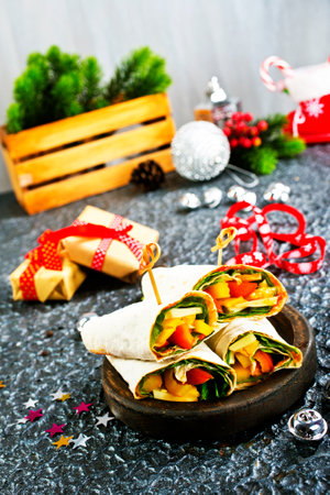 Salmon and cream cheese wraps. Rolls with smoked salmon, basil and rocket salad.の写真素材