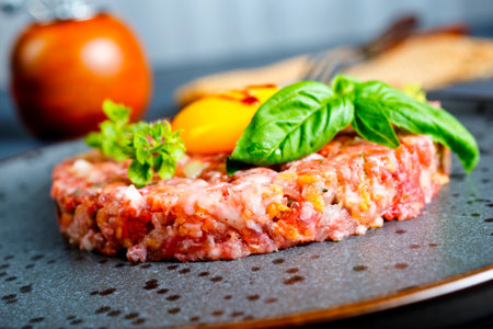 Top view of raw minced meat with liquid egg yolk for preparation of meatballの写真素材
