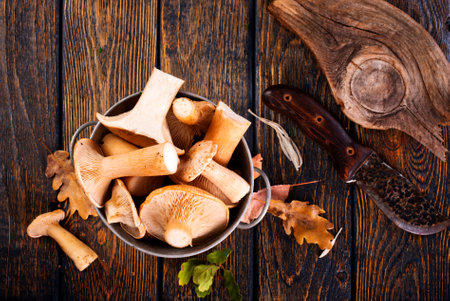 raw mushrooms, fresh mushrooms on wooden tableの写真素材