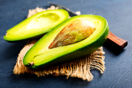 Avocado on dark table. fresh avocadoの写真素材