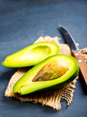 Avocado on dark table. fresh avocadoの写真素材