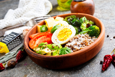 Boiled buckwheat with egg and fresh vegetables Top view.の写真素材