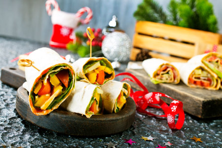 Salmon and cream cheese wraps. Rolls with smoked salmon, basil and rocket salad.の写真素材