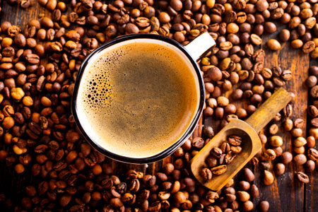 Coffee cup and coffee beans on wooden table. top view.の写真素材