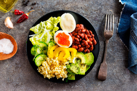 Buddha bowl, balanced food, vegetarian menu. Eggs, avocado, salad lettuce, bulgurの写真素材