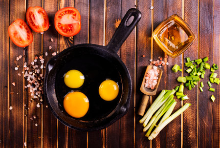 Raw chicken eggs on a table, dark backgroundの写真素材