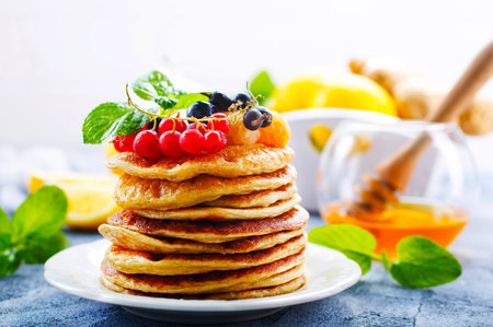 pancakes on white plate and on a tableの写真素材