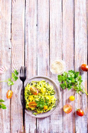 Raw Green Organic Zucchini Noodles Zoodles in a Bowlの写真素材