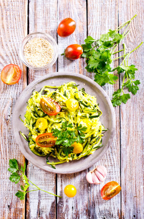 Raw Green Organic Zucchini Noodles Zoodles in a Bowlの写真素材