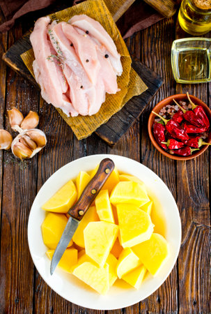 raw potato and chicken filletの写真素材