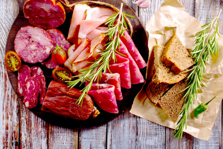 Slices of delicious spanish sausage salam, smoked meat, sausages. Healthy food concept.の写真素材