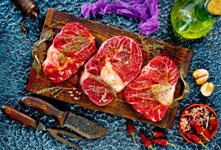 A few steak pieces on the wooden boardの写真素材