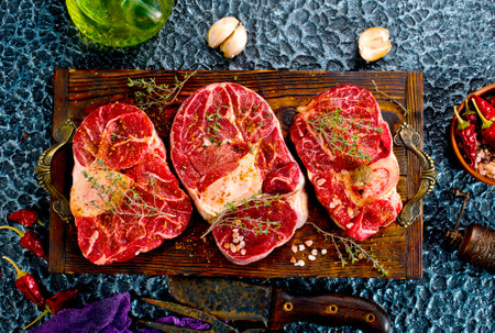 A few steak pieces on the wooden boardの写真素材