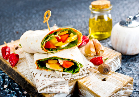 Shawarma sandwich with vegetable and cheese. Traditional Middle Eastern snack.の写真素材