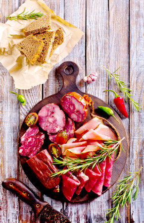 Slices of delicious spanish sausage salam, smoked meat, sausages. Healthy food concept.の写真素材
