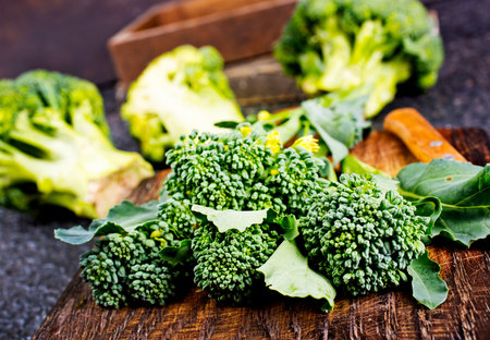 raw broccoli on wooden board, diet food, fresh broccoli