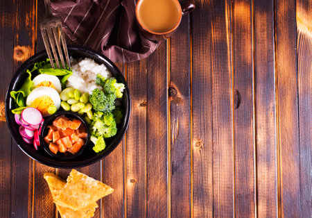 Rice with red fish, green beans and broccoli in a black plate. Diet. Top view. Free space for text.の写真素材