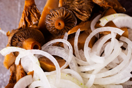 Marinated mushrooms in a glass bowl, mushrooms with onionの写真素材