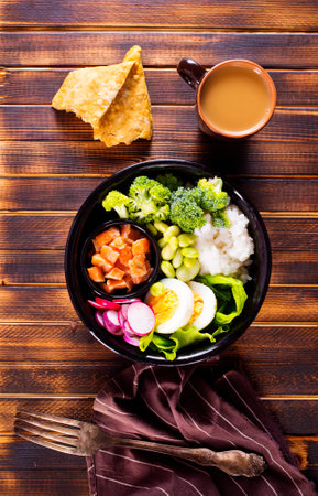 Rice with red fish, green beans and broccoli in a black plate. Diet. Top view. Free space for text.の写真素材