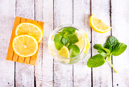 fresh lemon and mint for cocktail on a tableの写真素材