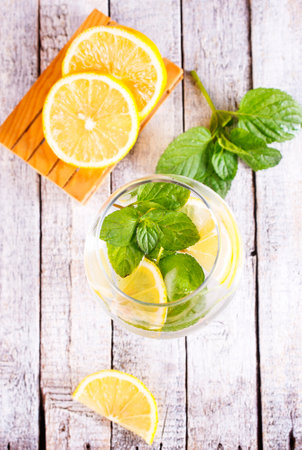 fresh lemon and mint for cocktail on a tableの写真素材