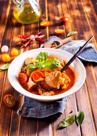 Homemade meat and vegetable stew or soup with tomato and spiceの写真素材