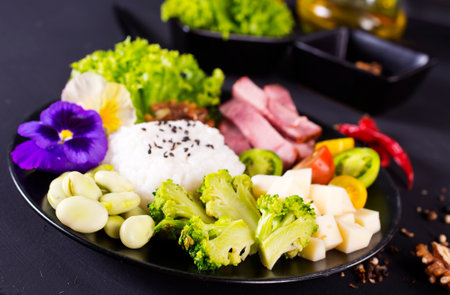 Rice and broccoli served on a plate on dark background, rice with vegetablesの写真素材