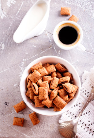 sweet crunchy chocolate children's breakfast in bowl on a white background.の写真素材