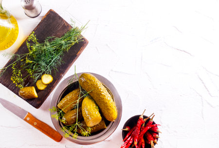 pickled cucumber in metal bowl, cucumber in bowl on a tableの写真素材