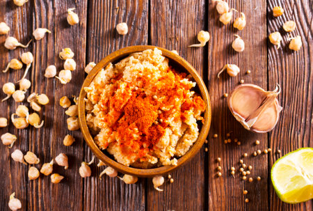 Bowl of hummus dip. Middle Eastern cuisine snack. Close-up view, side viewの写真素材